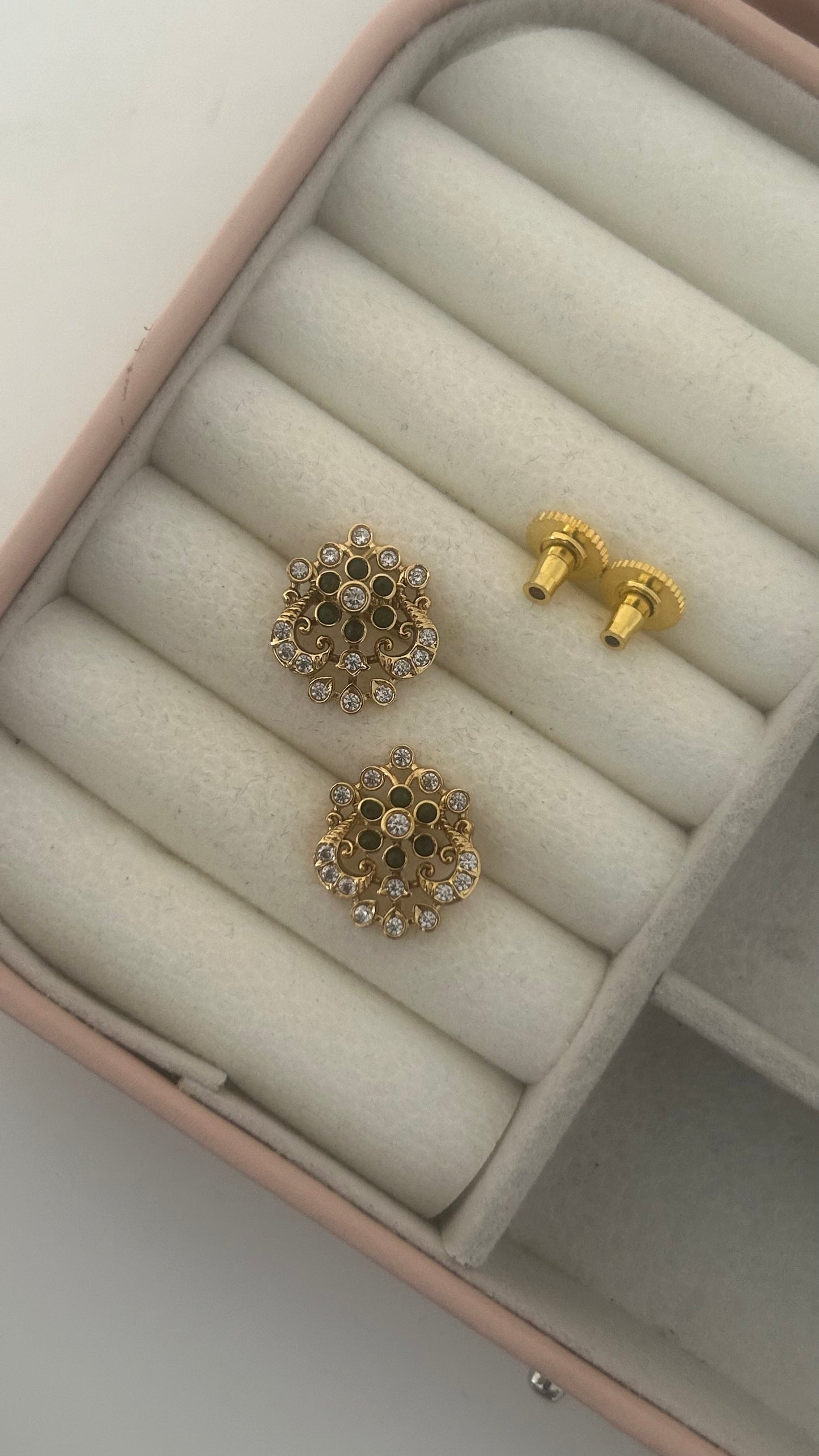 Flower stud with peacock pattern