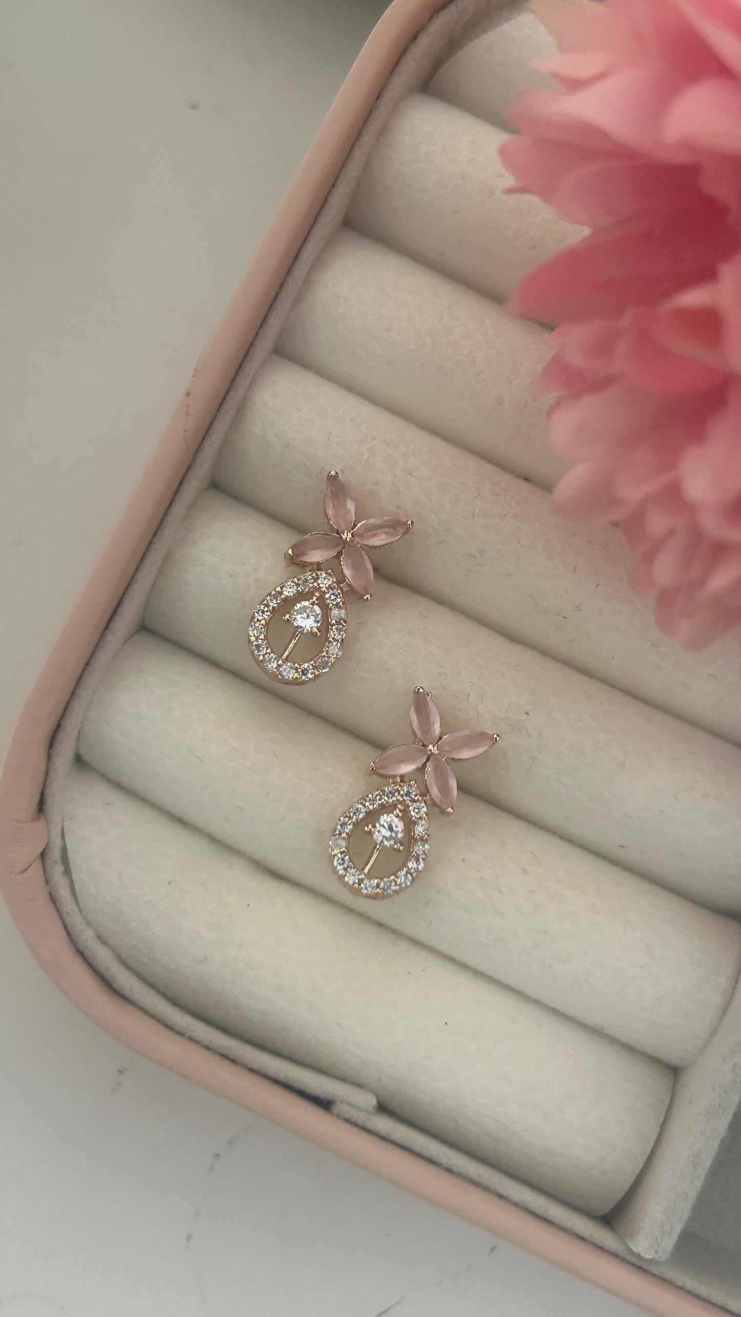 CZ 4 petal earring with oval shape drop
