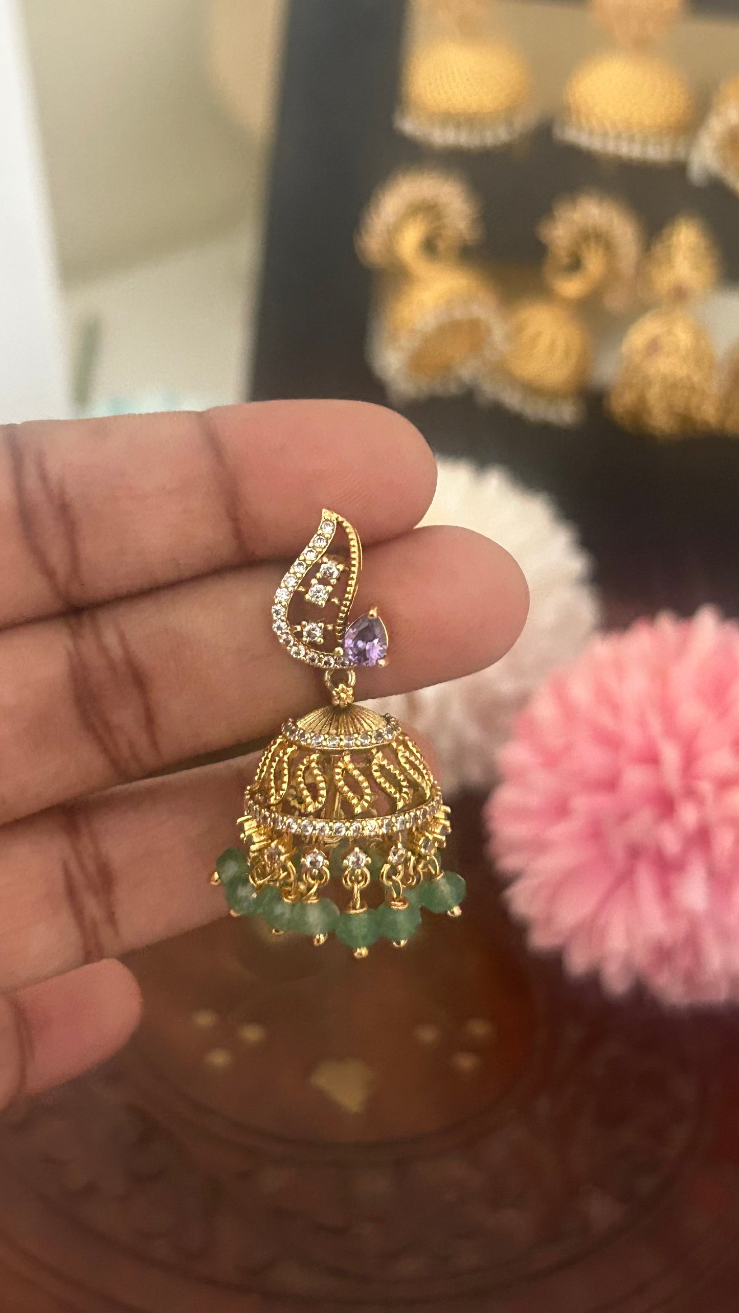 Purple stone butta with green beads hanging