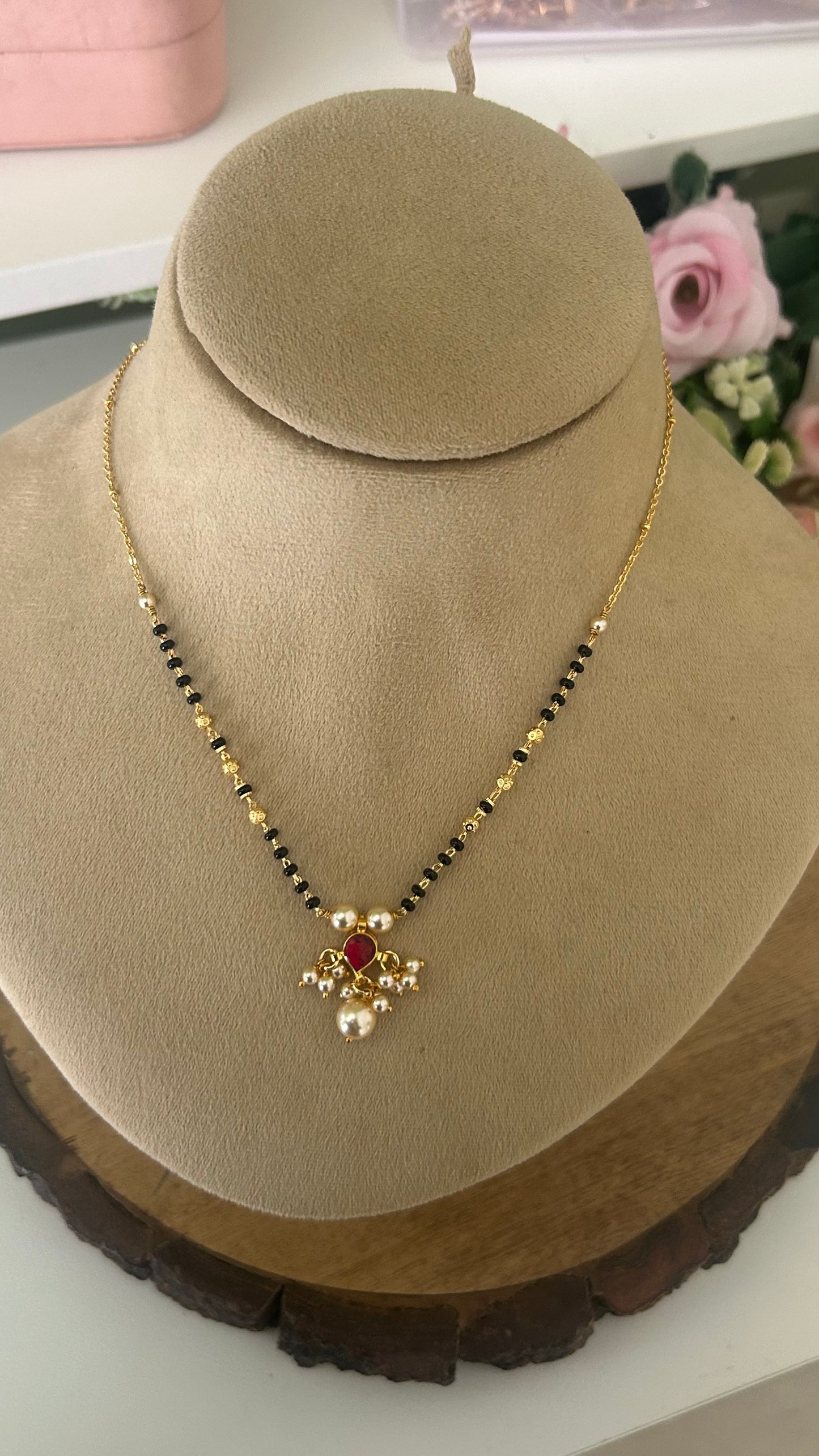 Designer Black Beads Mangalsutra with Ruby kundan Pearl Pendant in 16 to 18 inch