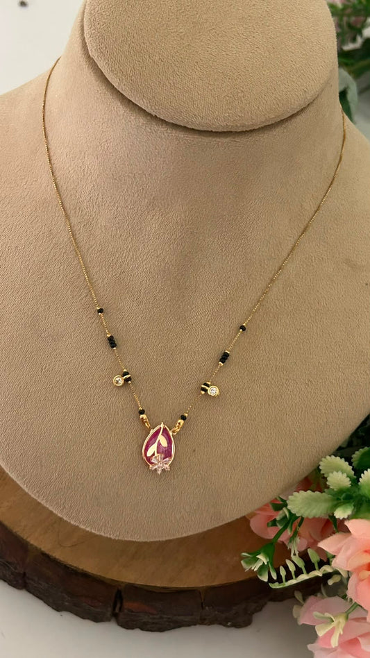 Fancy Gold Look Mangalsutra with Black Beads and Stone Pendant