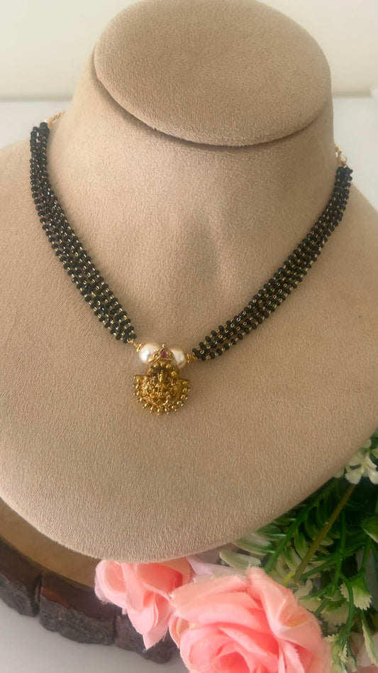 Traditional Black Beads Choker Necklace with Gold Lakshmi Pendant & Pearl Accents