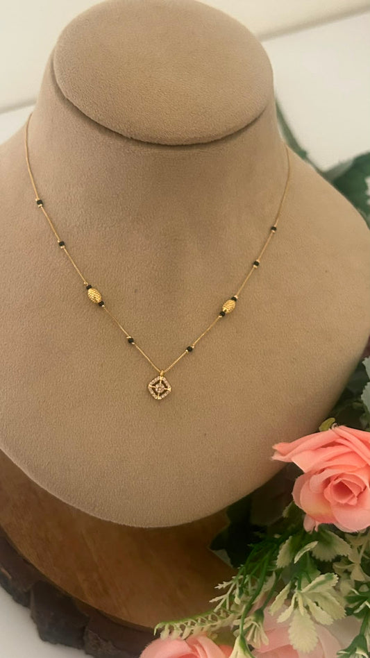 Black Beads Mangalsutra Chain with Floral CZ Pendant and Textured Gold Beads