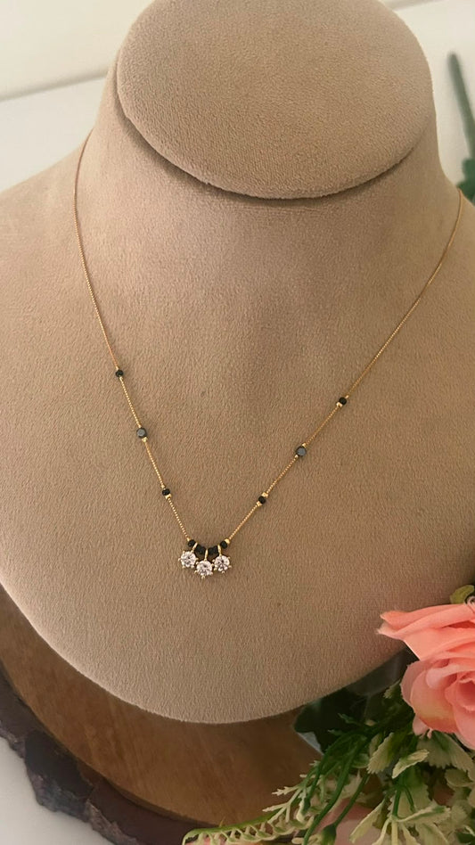 Elegant Three Blossom CZ Black Beads Mangalsutra Chain with Gold Finish