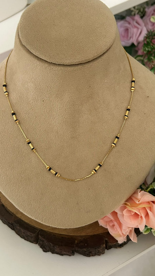 Modern Minimalist Black Beads Short Mangalsutra with Grooved Gold Spacers