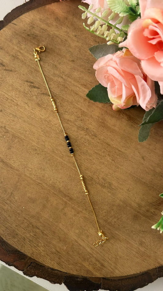 Minimalist Black Beads Nazariya Bracelet with Grooved Metallic Accents