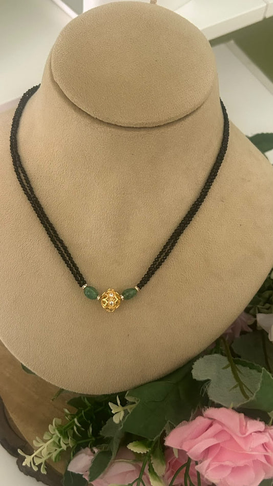 Elegant Double Line Black Beads Mangalsutra with Green Strawberry Beads & Gold Tone AD Stone Ball Pendant for Women