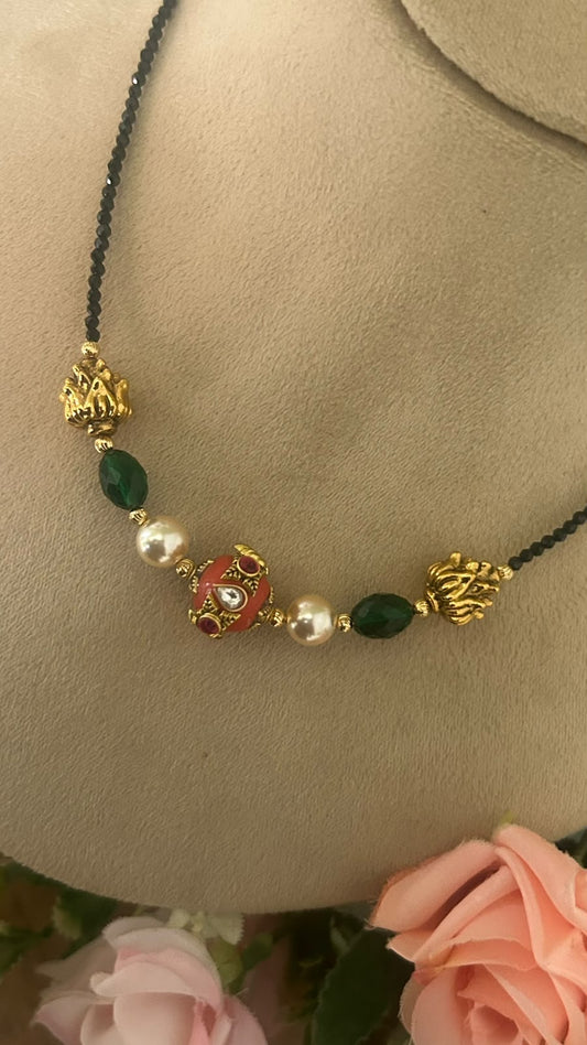 Elegant Invisible Black Beads Mangalsutra with Red Enamel Bead, Green Stones, Pearls & Antique Gold Tone Designer Accents for Women