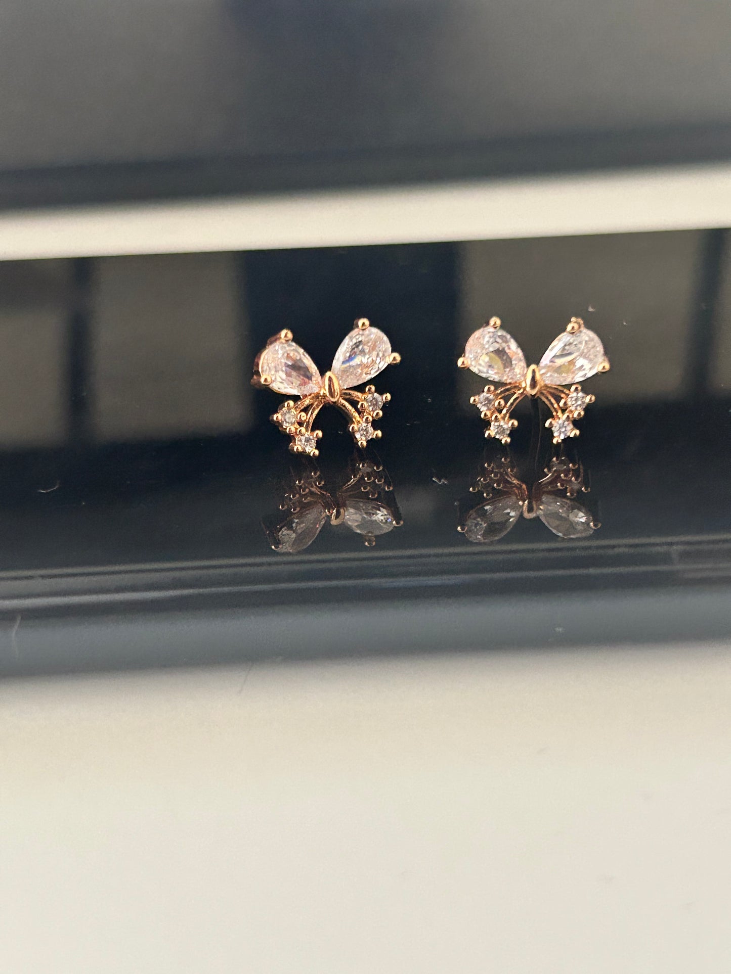 CZ floral butterfly stud