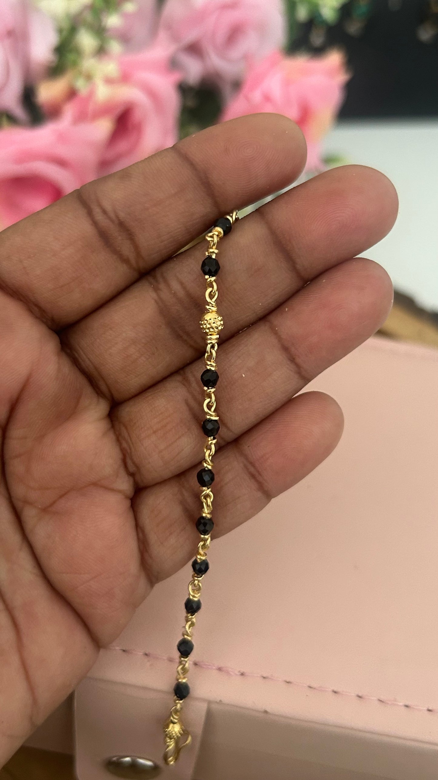 "Panchaloham Black Beads Bracelet (Unpolished) –  24, 26 & 28, bangles  sizes it fits comfortably for these measurements."