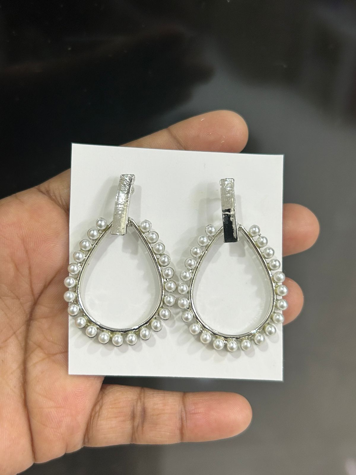 Fancy white pearls border earrings