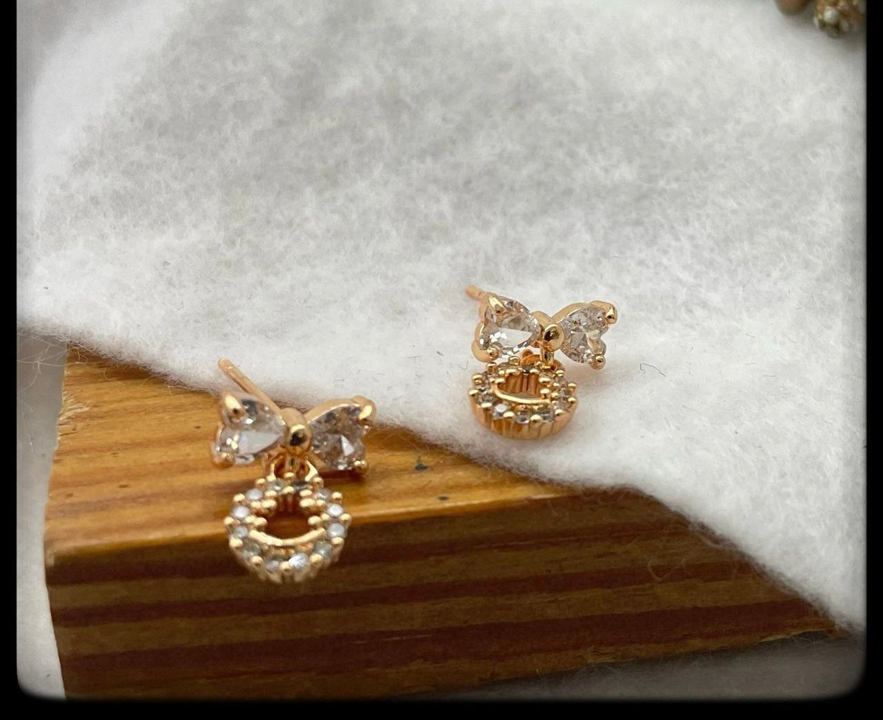 CZ white bow earrings with drops