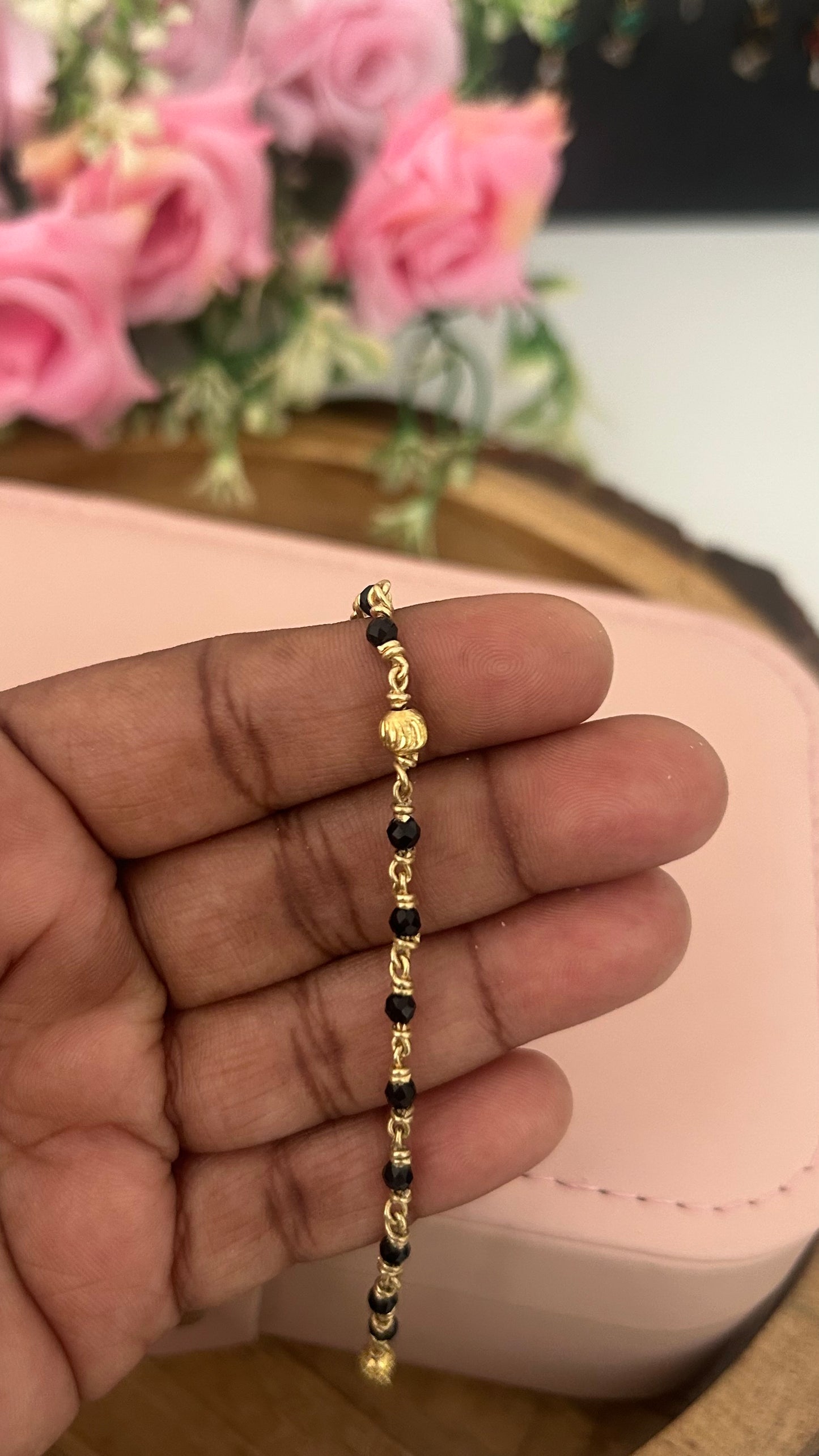 "Panchaloham Black Beads Bracelet (Unpolished) –  24, 26 & 28, bangles  sizes it fits comfortably for these measurements."