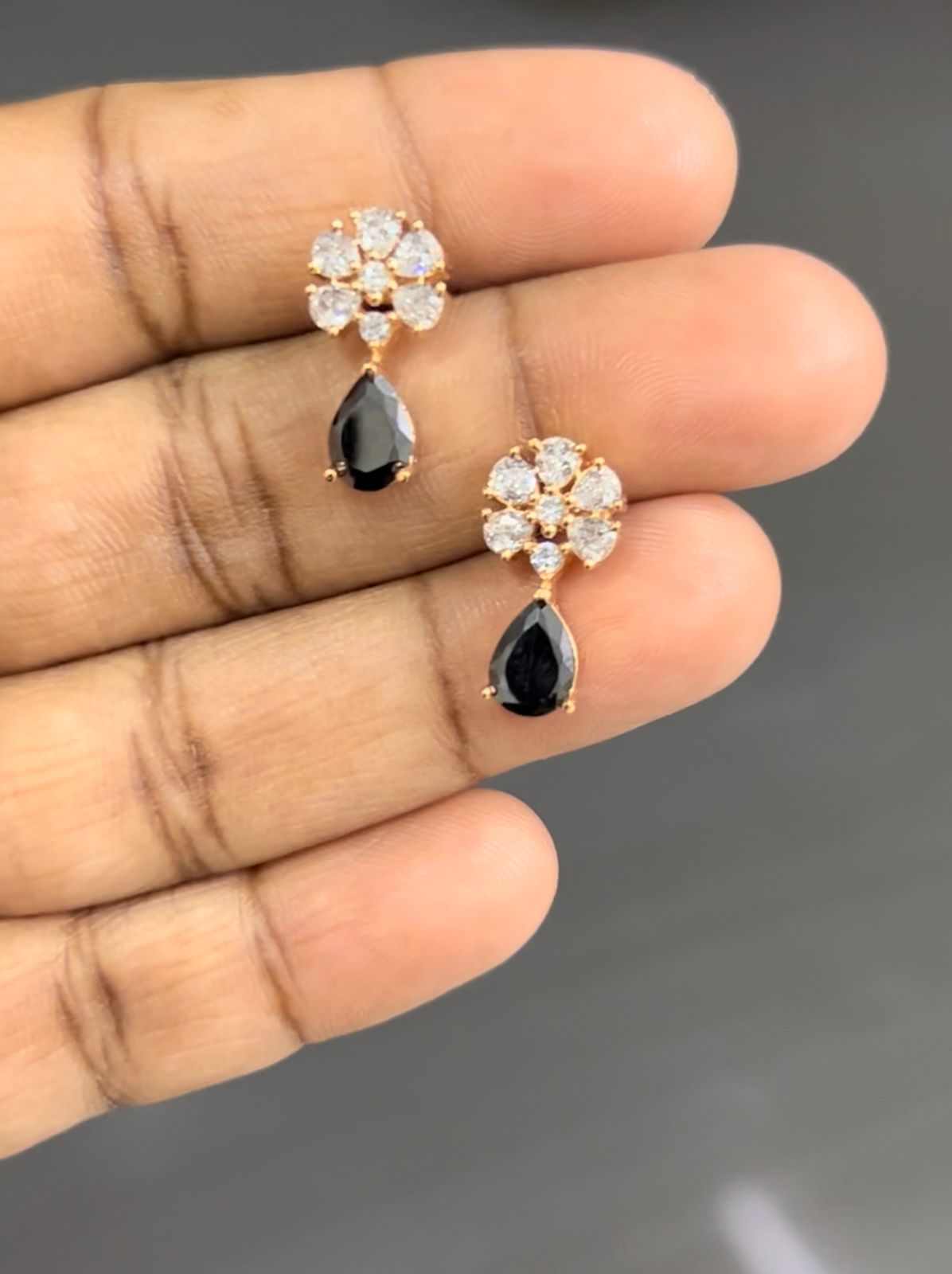 CZ FLOWER WITH BLACK STONE STUD