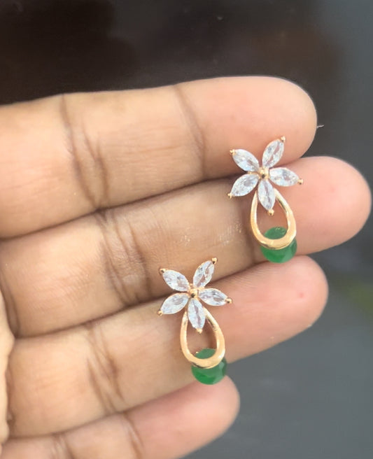 CZ white flower stud with green stone