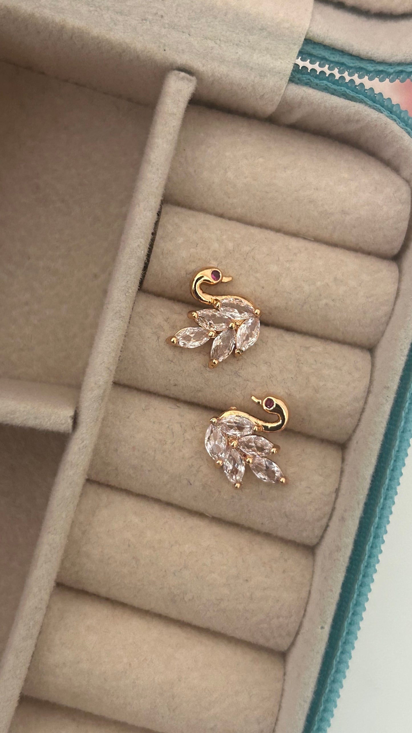 Gold-Plated Swan Shaped Stud Earrings – CZ Feather Design with Ruby Eye Accent