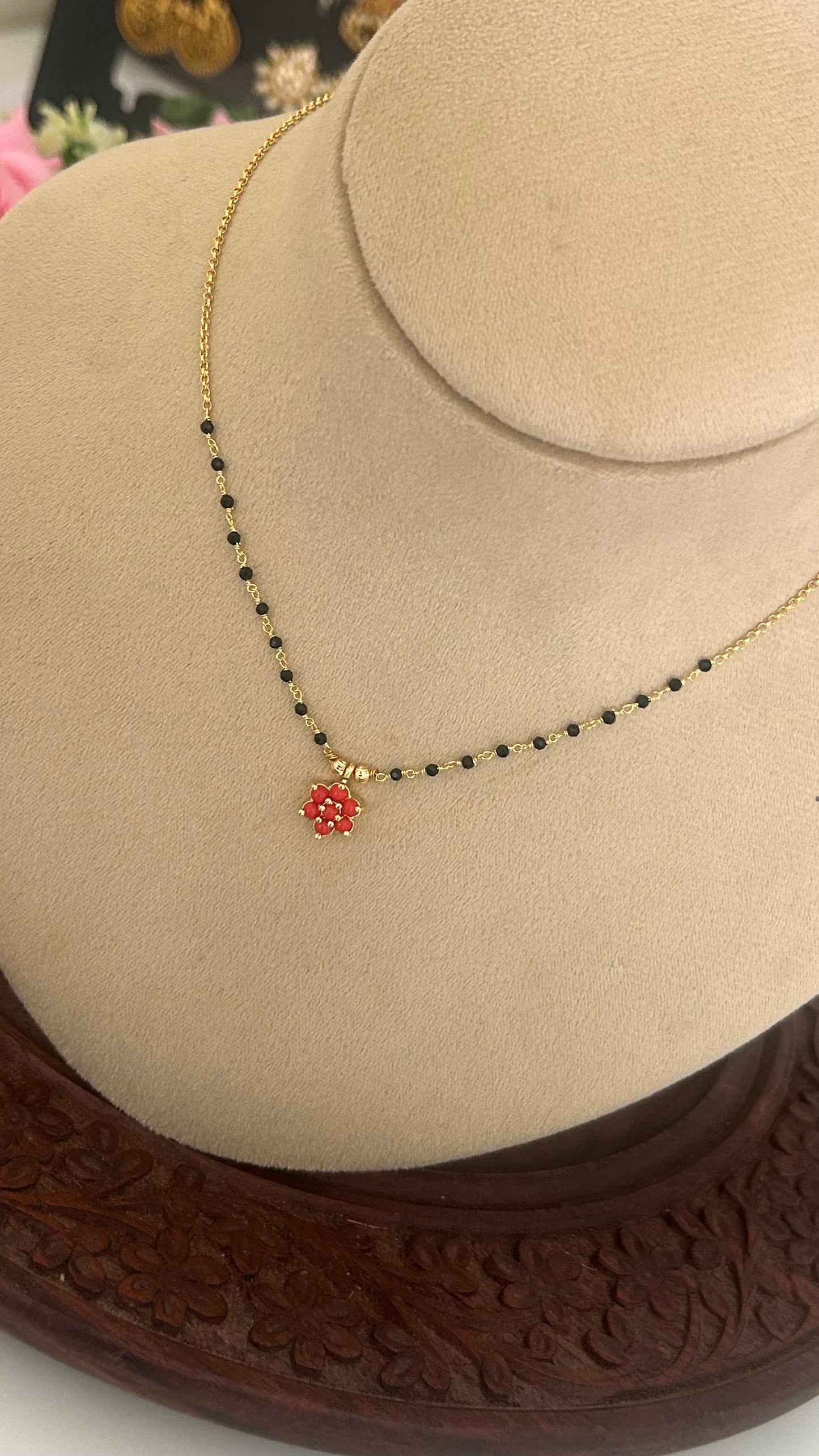 Black bead with coral pendent in 15 inches