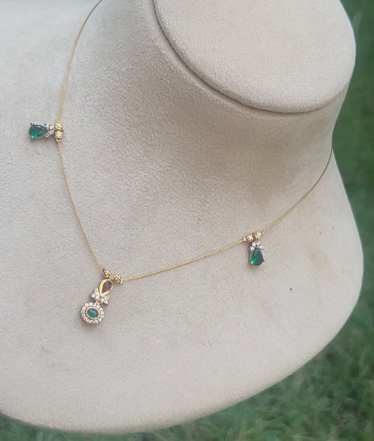 Invisible chain with green pendent