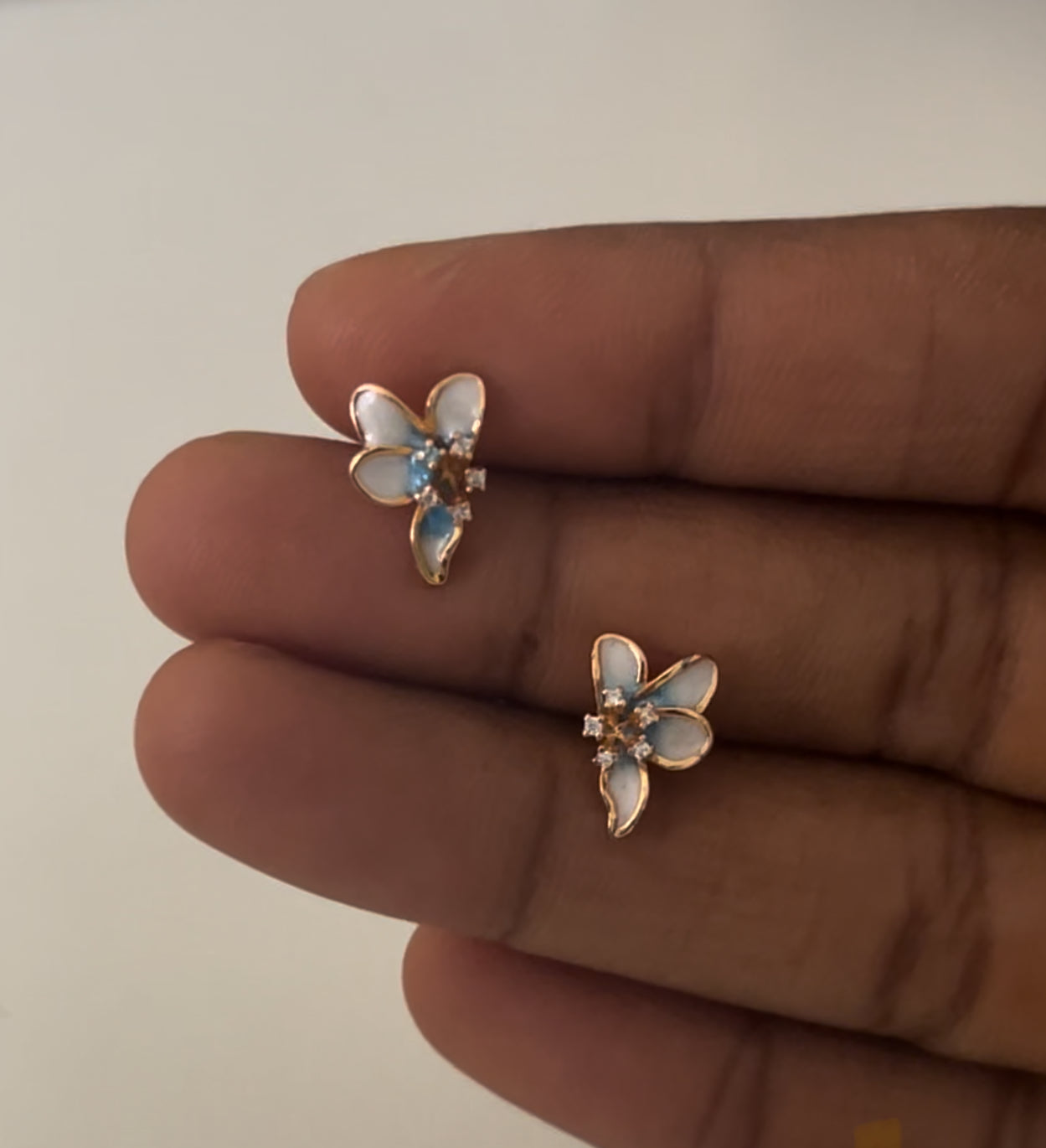 CZ light blue color fancy flower stud