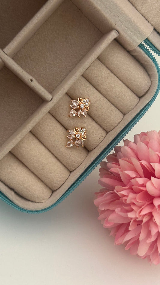 CZ white flower stud with small love symbol