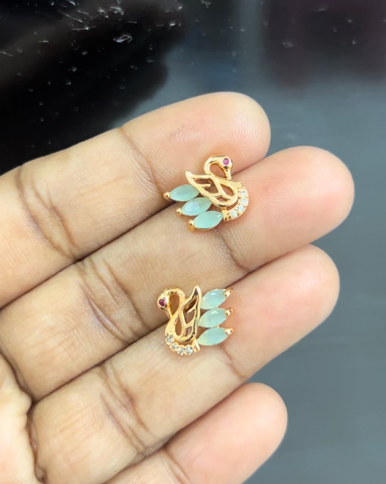 CZ peach color swan stud