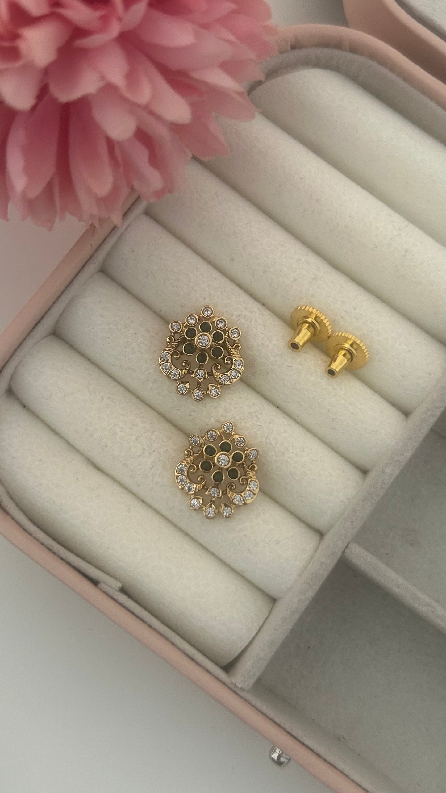 Flower stud with peacock pattern