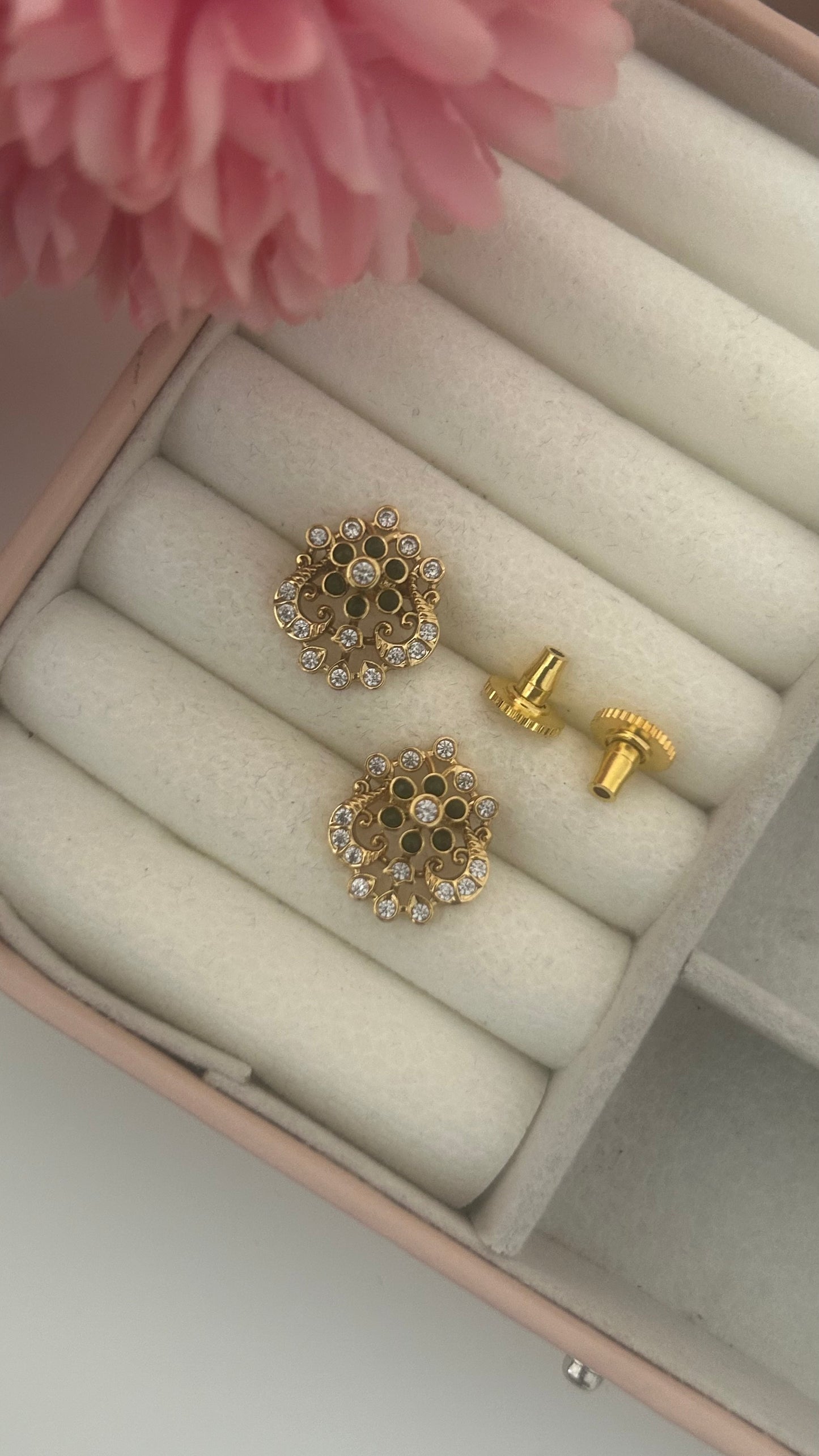 Flower stud with peacock pattern