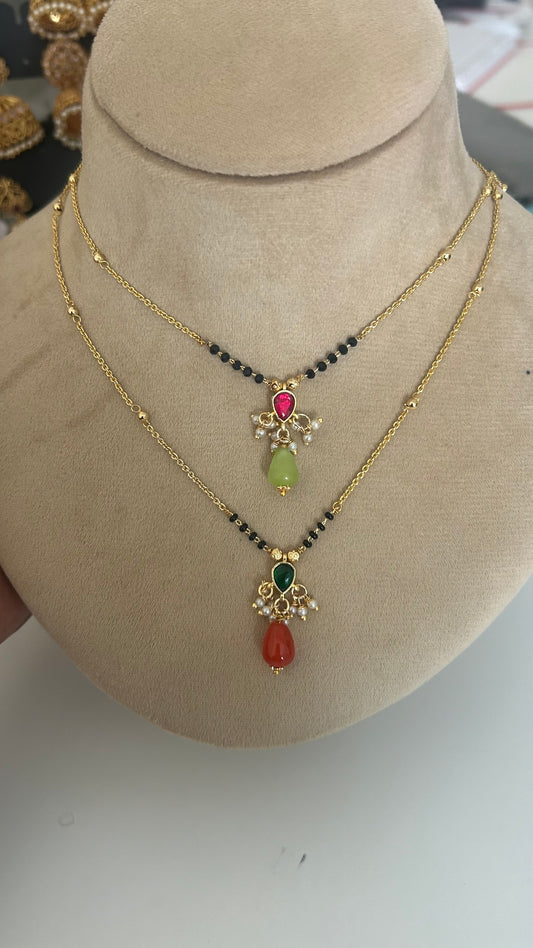 Blackbeads with Kundan pendent and monalisa beads hanging in 2 colors