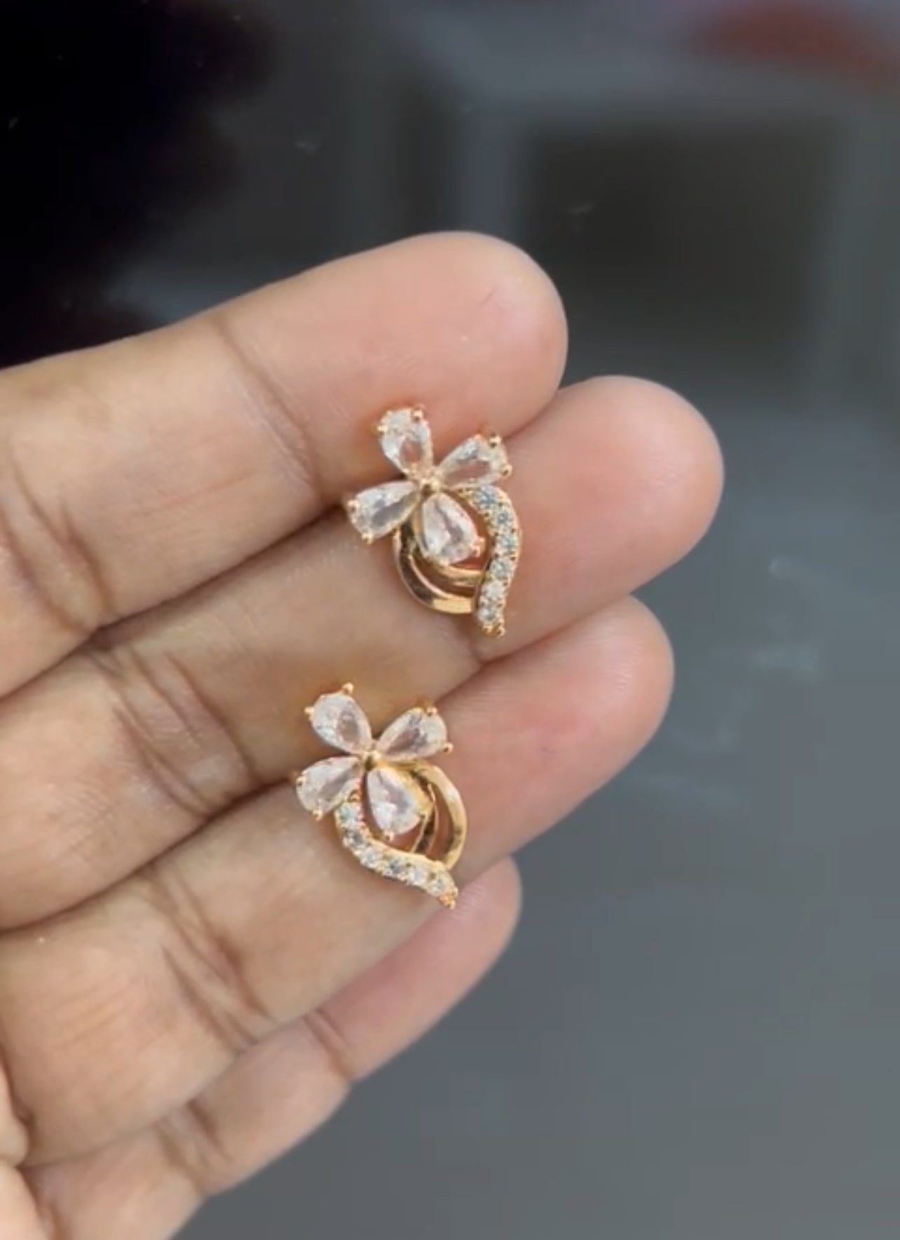 CZ 4 petal flower stone stud in colors