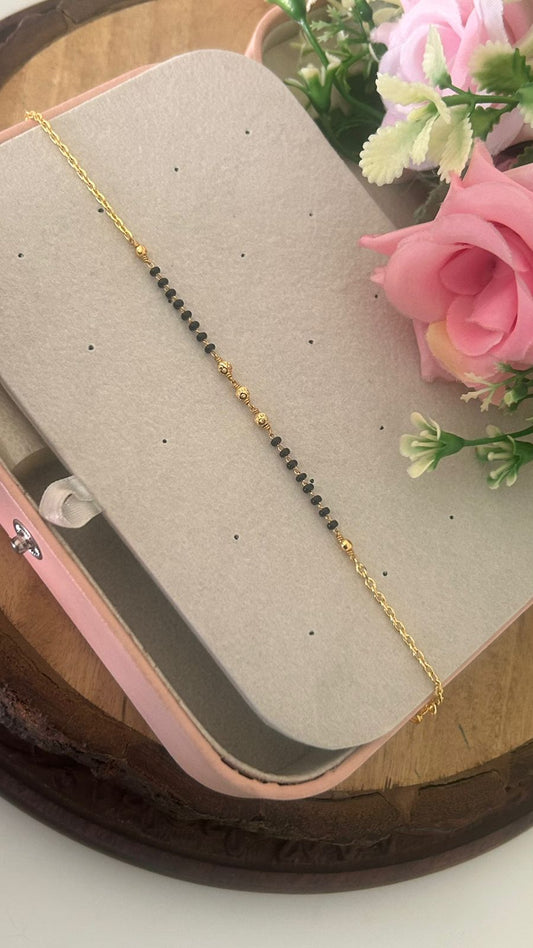 Delicate Black Bead Mangalsutra Chain Bracelet with Gold Detailing – Daily Wear Bracelet