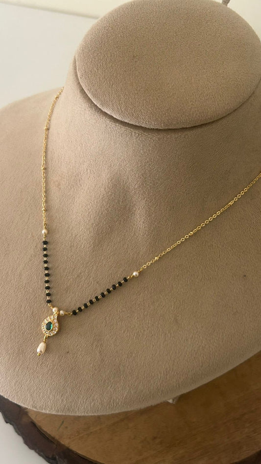 Elegant Black Beads Mangalsutra with Green Stone Pendant and Pearl Drop