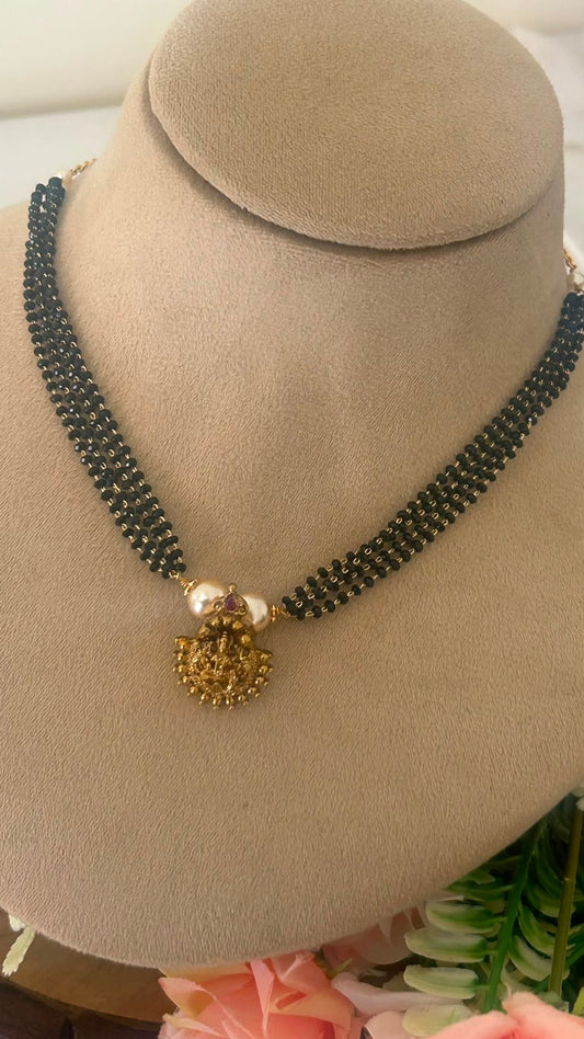Traditional Black Beads Choker Necklace with Gold Lakshmi Pendant & Pearl Accents
