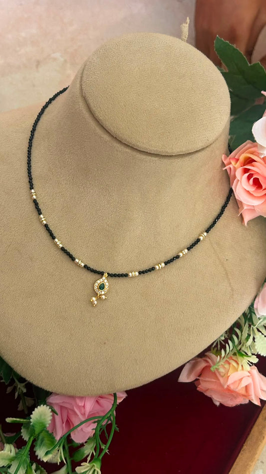 Elegant Invisible Black Beads Necklace with Green CZ Teardrop Pendant and Gold-Tone Beads for Women