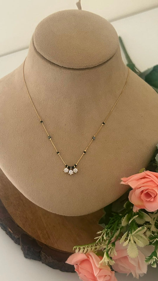 Elegant Three Blossom CZ Black Beads Mangalsutra Chain with Gold Finish