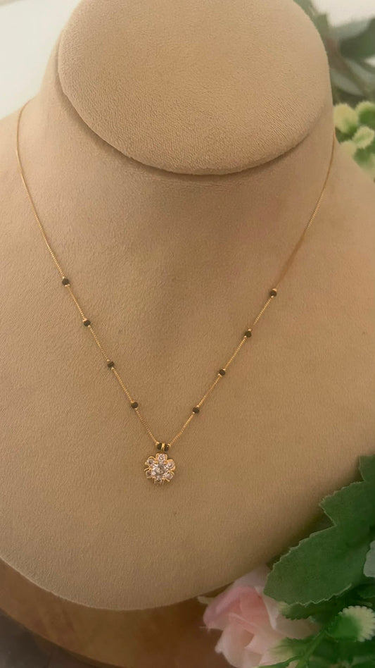Radiant Blossom CZ Pendant Black Beads Mangalsutra Chain with Gold Finish