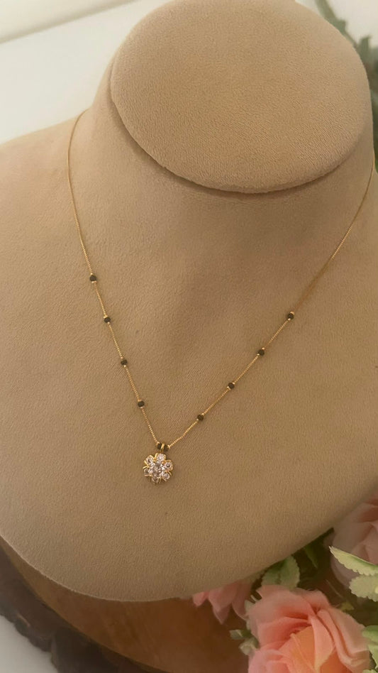 Radiant Blossom CZ Pendant Black Beads Mangalsutra Chain with Gold Finish