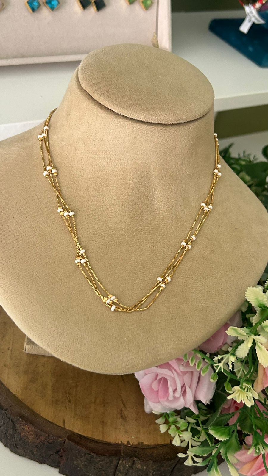Elegant Triple Strand Gold Necklace with White Micro Bead Stations