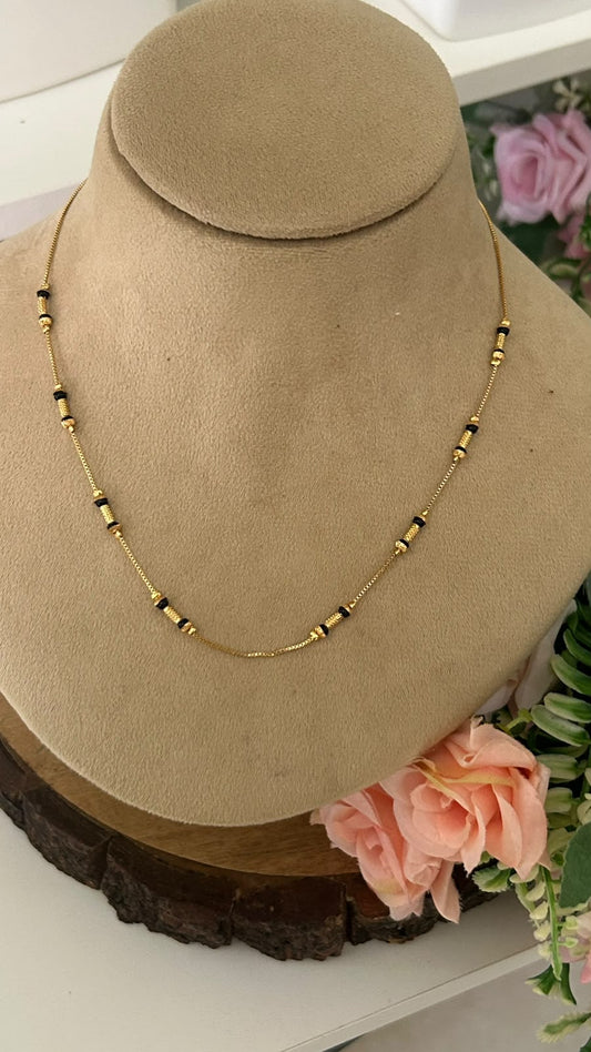 Modern Minimalist Black Beads Short Mangalsutra with Grooved Gold Spacers