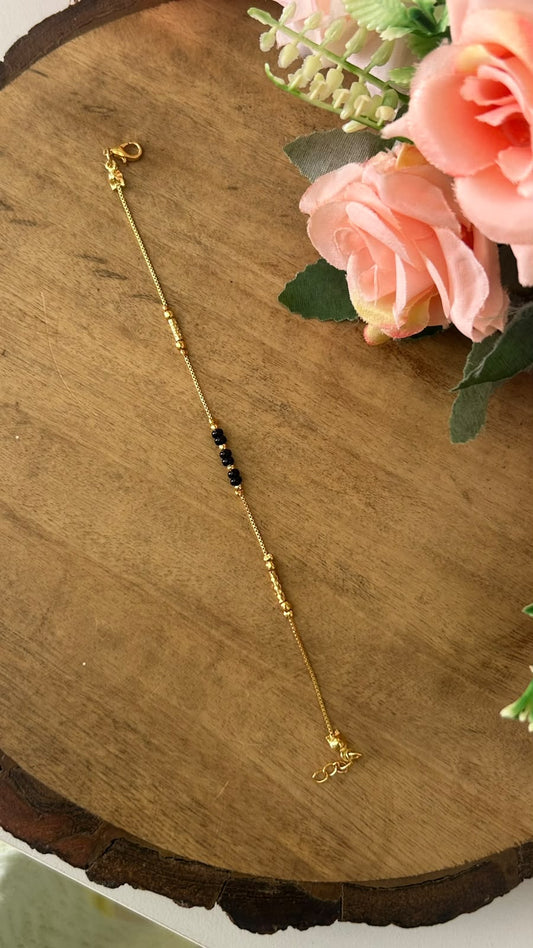 Minimalist Black Beads Nazariya Bracelet with Grooved Metallic Accents