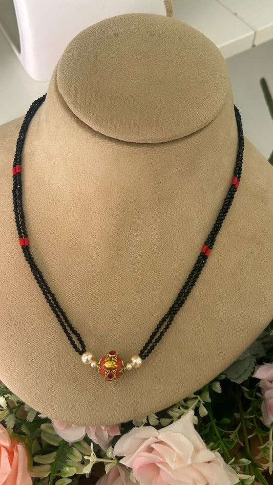 Designer Double Line Black Beads Mangalsutra with Red & Gold-Tone Traditional Pendant and Pearl Accents for Women