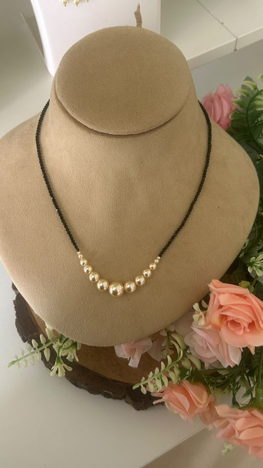 Elegant Single Line Black Beads Mangalsutra Necklace with Graduated Golden Pearl Beads for Women