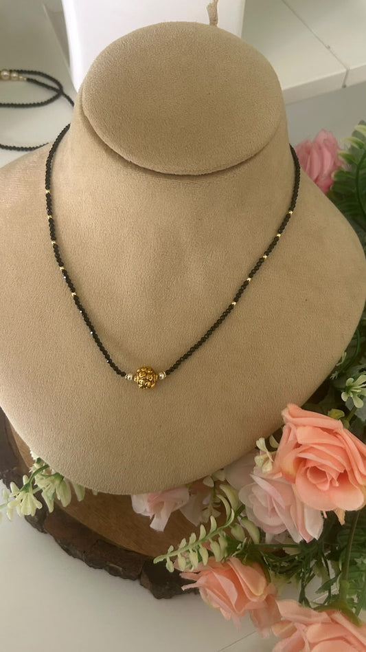 Elegant Single Line Black Beads Mangalsutra Necklace with Antique Gold Floral Ball Pendant & Gold Bead Accents for Women