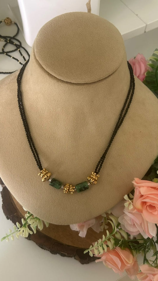 Elegant Double Line Black Beads Mangalsutra Necklace with Green Stone Beads & Antique Gold Floral Accents for Women