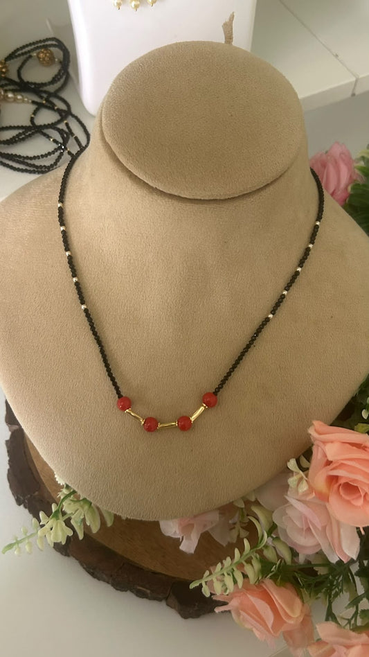 Elegant Single Line Black Beads Mangalsutra Necklace with Red Beads & Gold Tone Tube Accents for Women