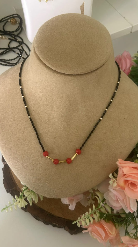 Elegant Single Line Black Beads Mangalsutra Necklace with Red Beads & Gold Tone Tube Accents for Women