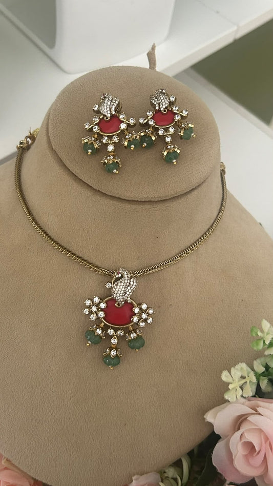 Royal Peacock Motif Gold-Tone Necklace & Earrings Set with Ruby Red Accents, Green Bead Hangings and Sparkling White Stones