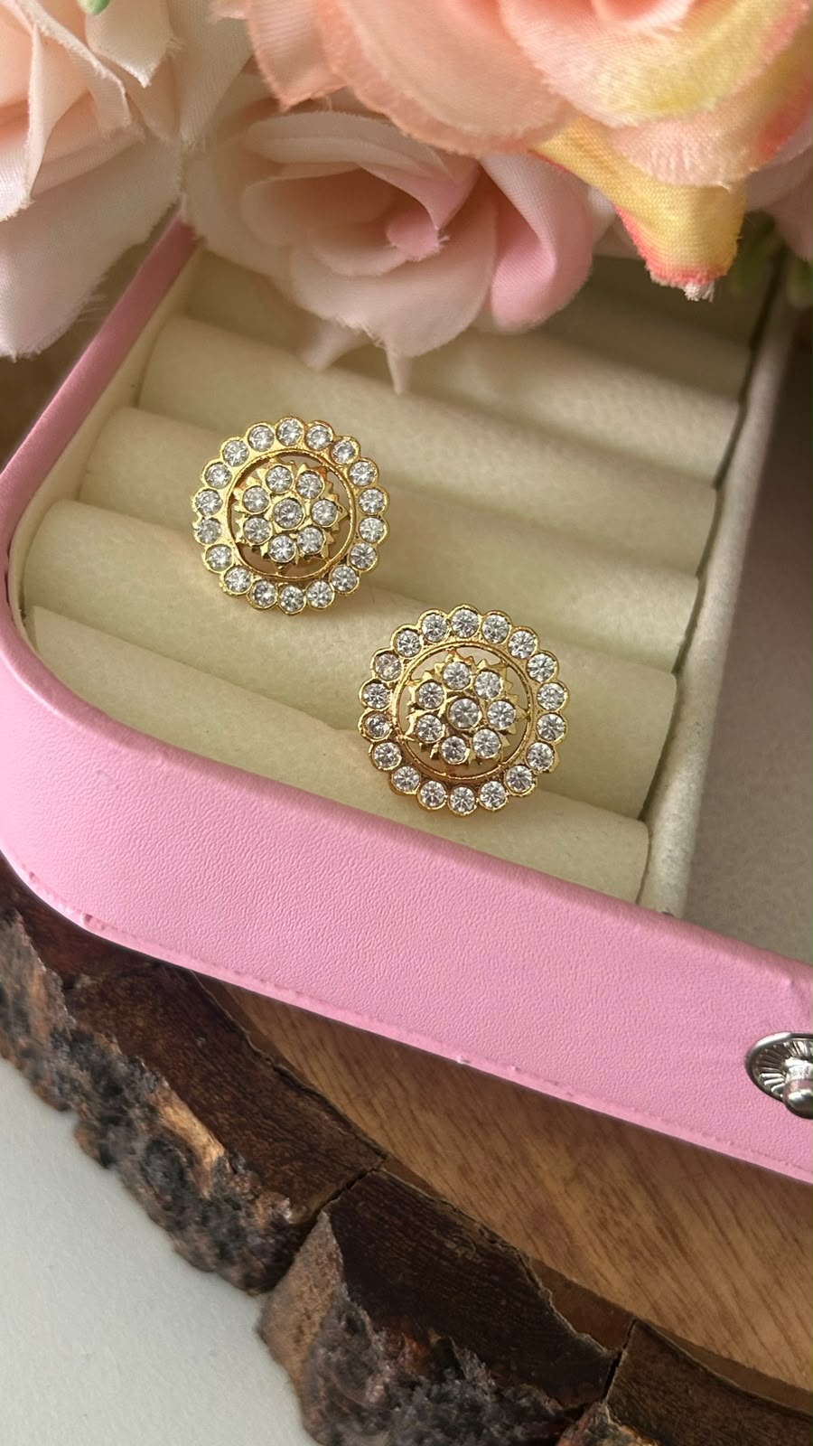 Royal Blossom Panchaloham Gold Polished Circular Floral Stud Earrings with White AD Stones for Women            Is this conversation helpful so far?