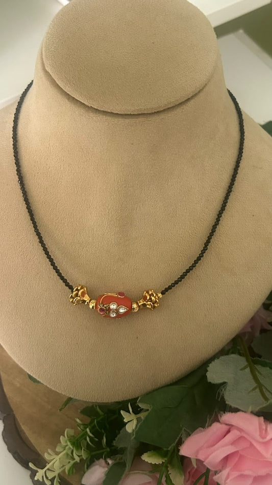 Elegant Invisible Black Beads Mangalsutra with Red Enamel Bead & Gold Tone Designer Accents for Women