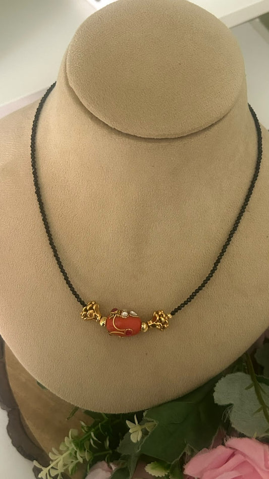 Elegant Invisible Black Beads Mangalsutra with Red Enamel Bead & Gold Tone Designer Accents for Women
