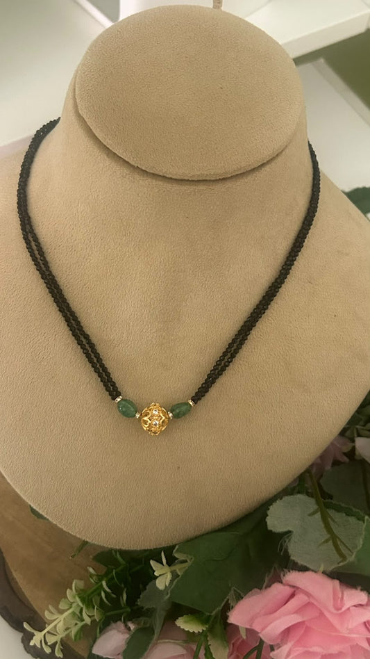 Elegant Double Line Black Beads Mangalsutra with Green Strawberry Beads & Gold Tone AD Stone Ball Pendant for Women